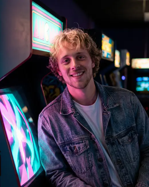 A gaming creator in a neon arcade
