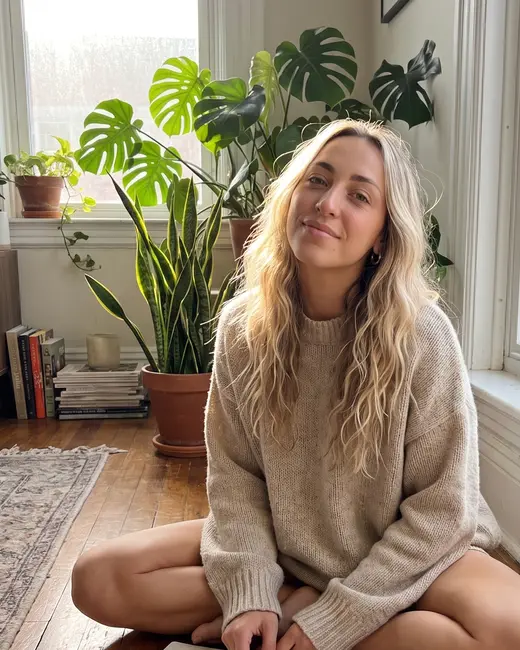 A lifestyle creator journaling on the floor of her flat